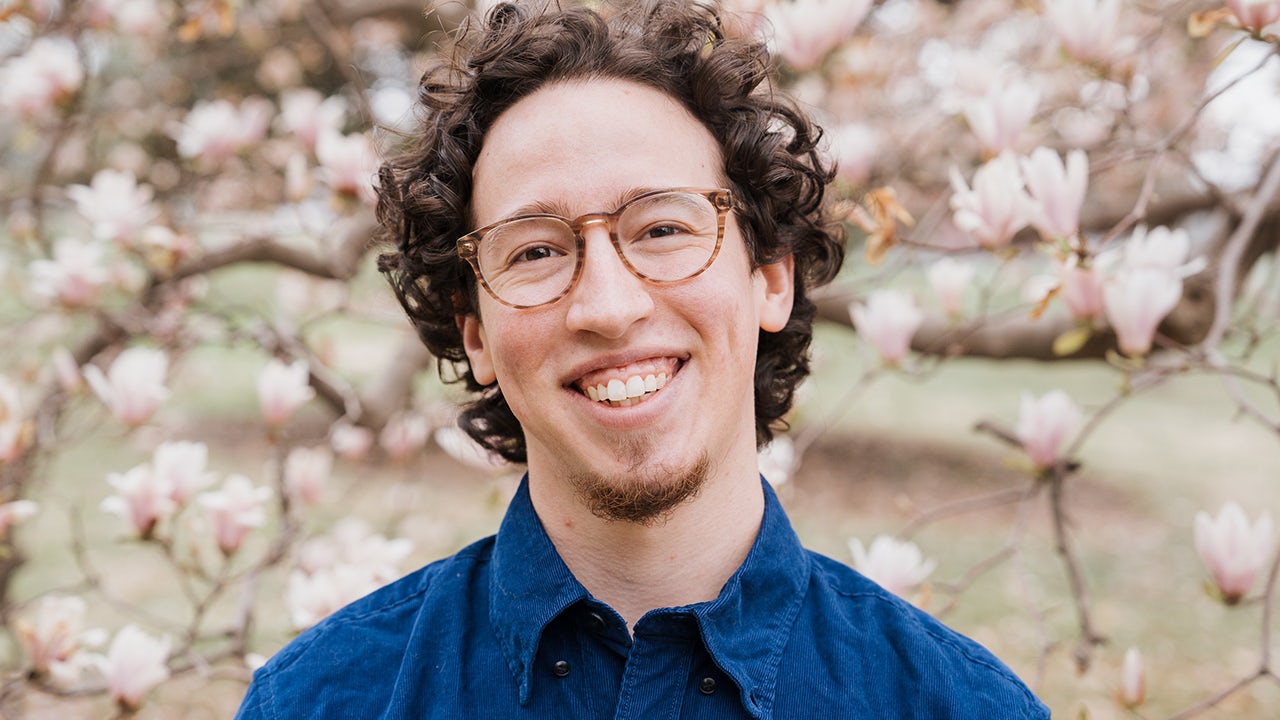 A poster promoting LGBTQ inclusion within Siemens, featuring a diverse group of people standing together.