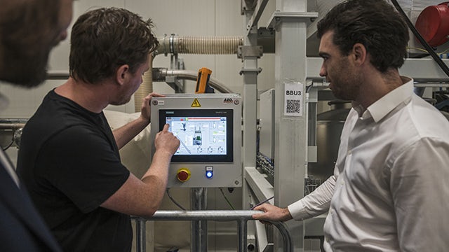 Professionals program touchscreen on production machine