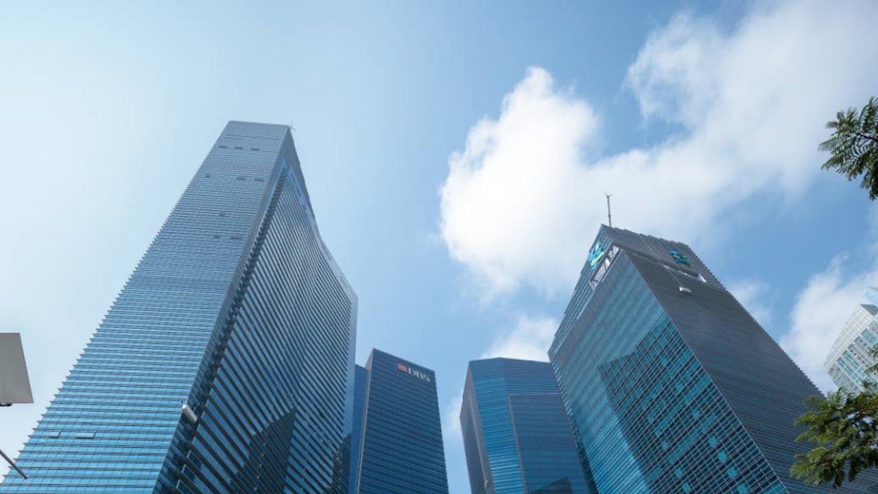 Four tall buildings making up Marina Bay Financial Centre.