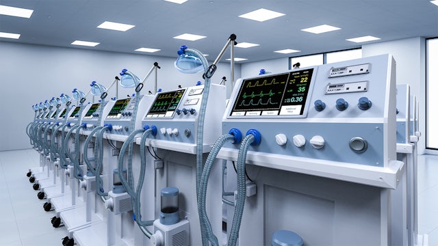 A row of ventilators in an otherwise empty room.