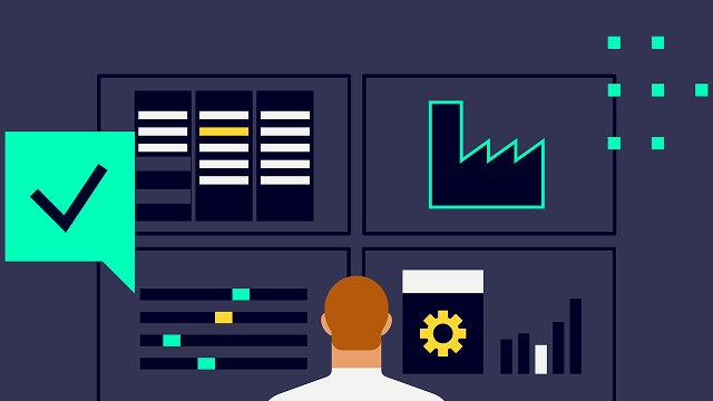 A person is working on a laptop while sitting on a chair in an office.