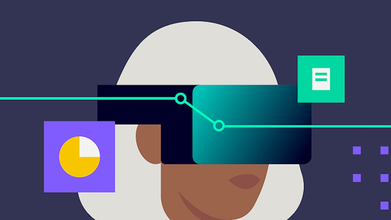 A person wearing a virtual reality headset is working on a laptop while standing in a room.