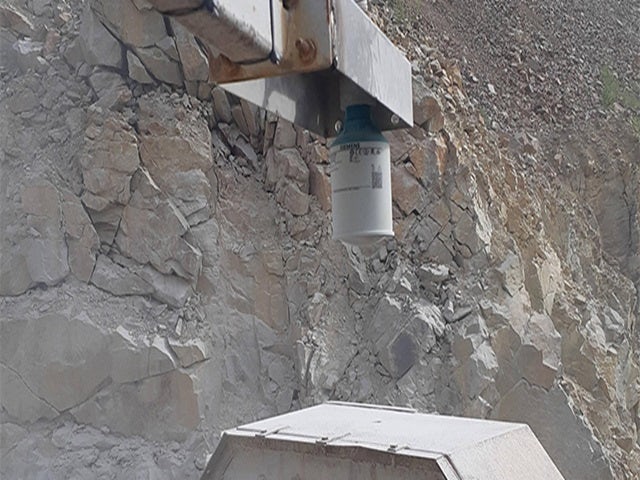 Quarry machinery sifts rocks.