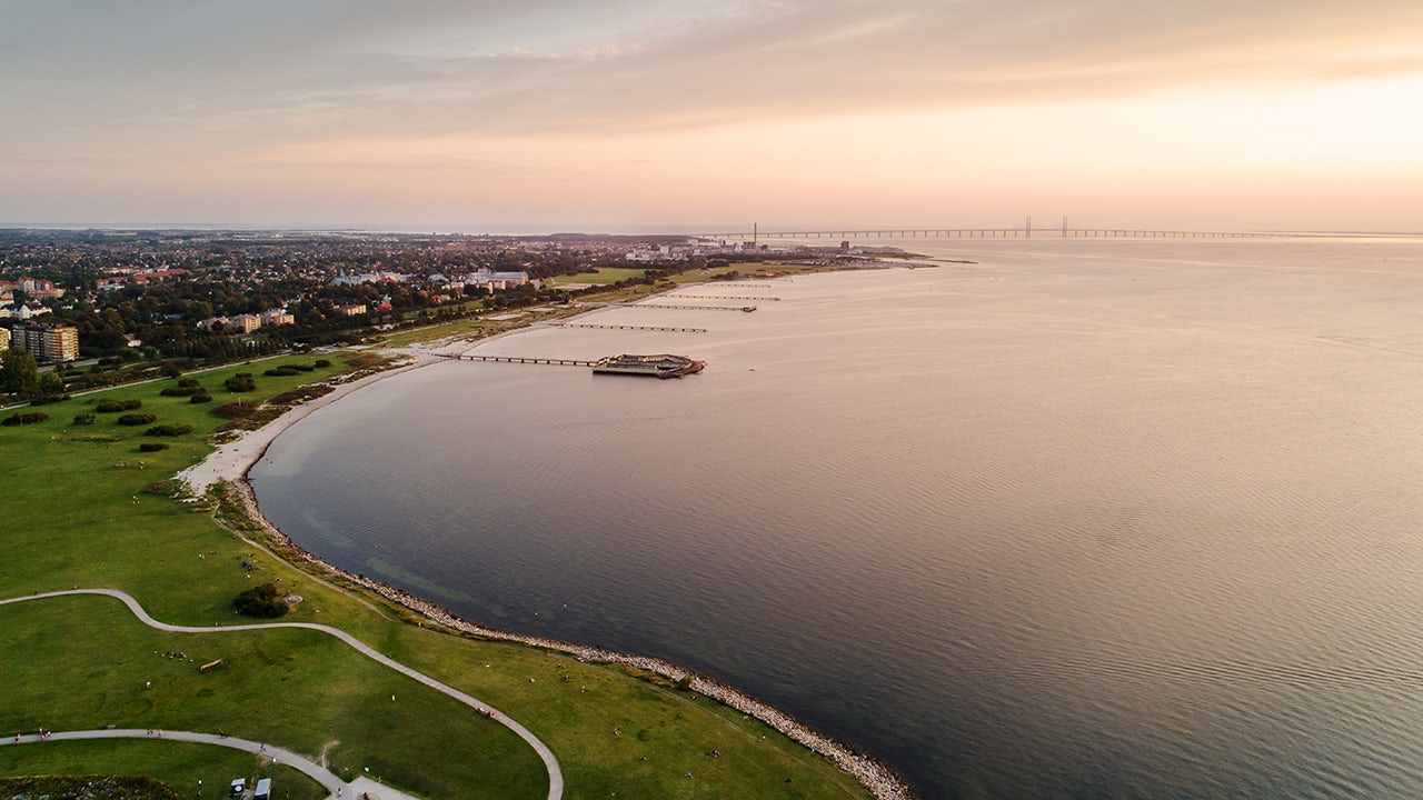 A landscape image showing a water pipeline with a focus on non-revenue water management.