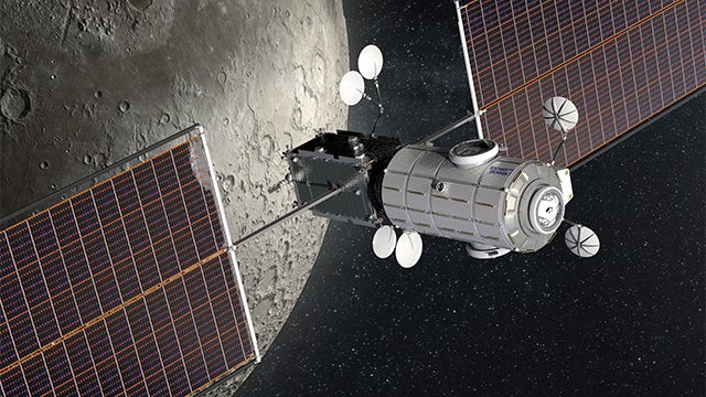 Satellite in front of the moon.