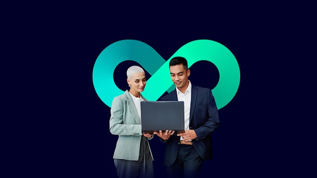 Two people standing in front of the infinity loop.