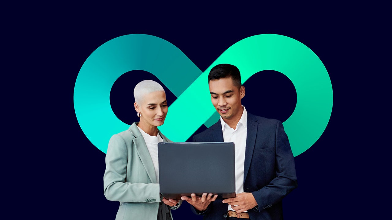 A person is standing in front of a large screen displaying a graph with a blue background.