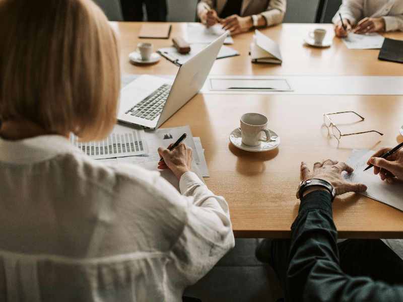 Business meeting in progress at conference table