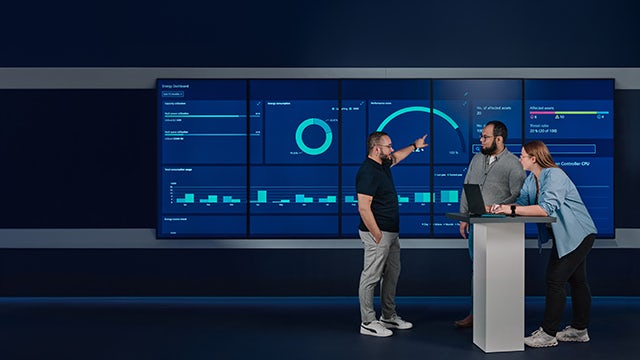 A safety feature image showing a person wearing a safety helmet and goggles while working on a machine.