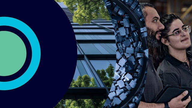 Two people are examining something off-screen, looking satisfied with the result. 