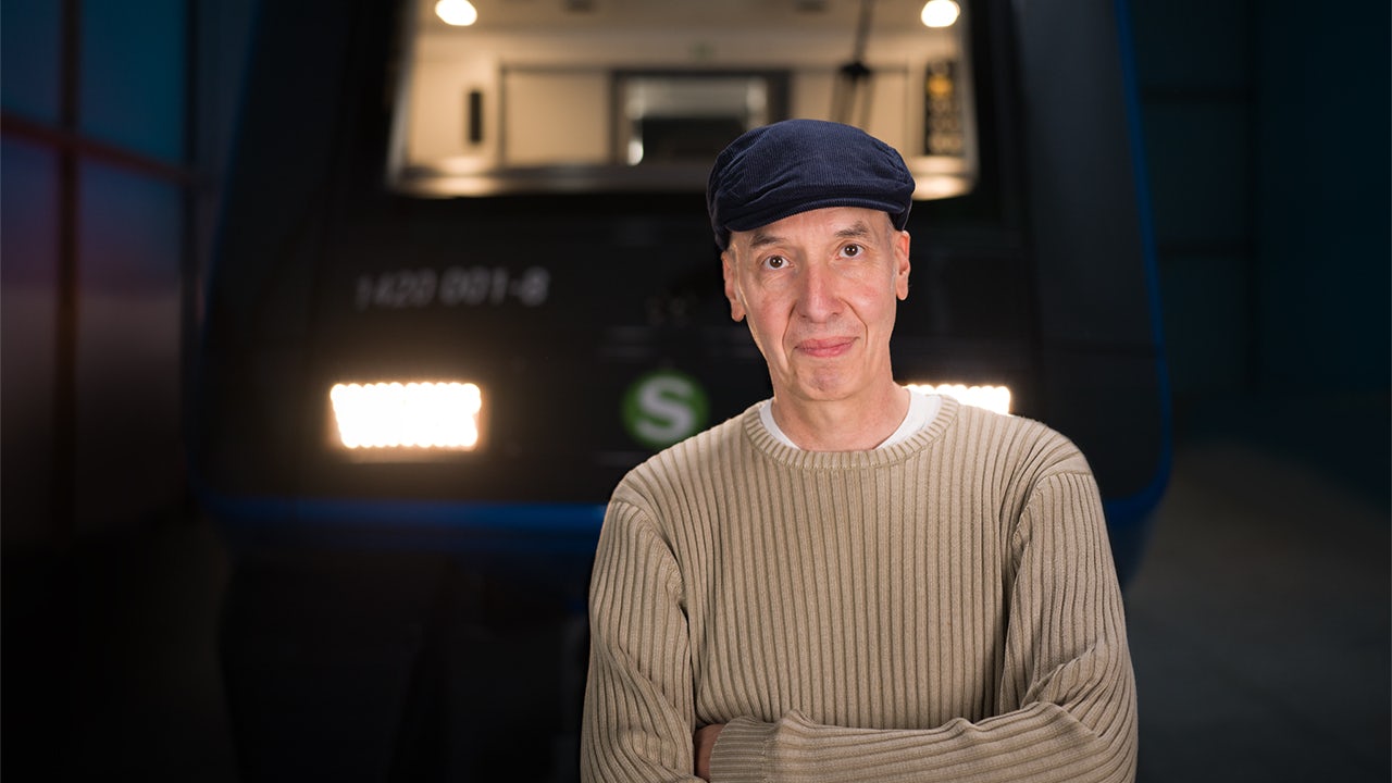 A modern urban public transport vehicle with sleek design and large windows.