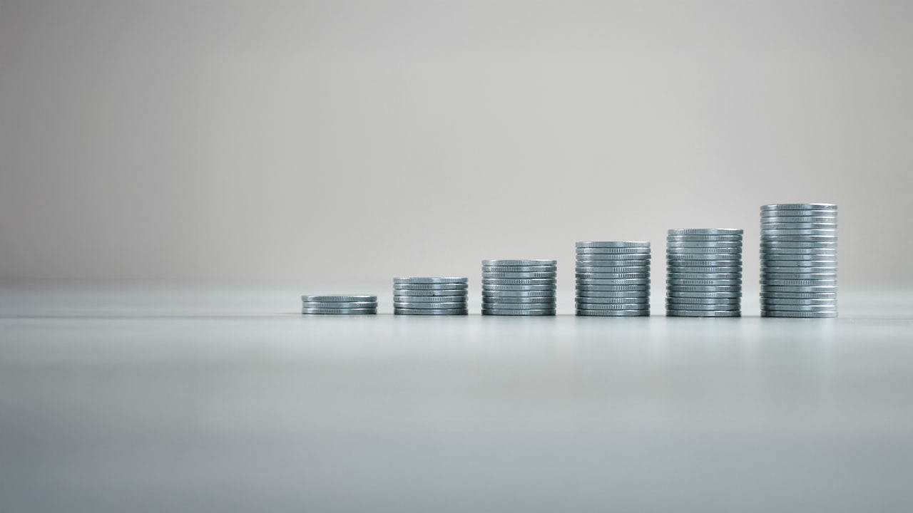 A stack of coins arranged in ascending order to represent growth.