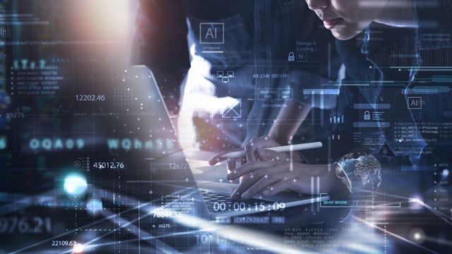 Two colleagues type on a laptop, surrounded by a graphical overlay of code and icons representing AI.