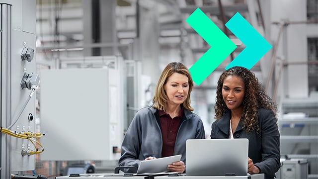 A group of women in a conference room discussing innovation and technology.