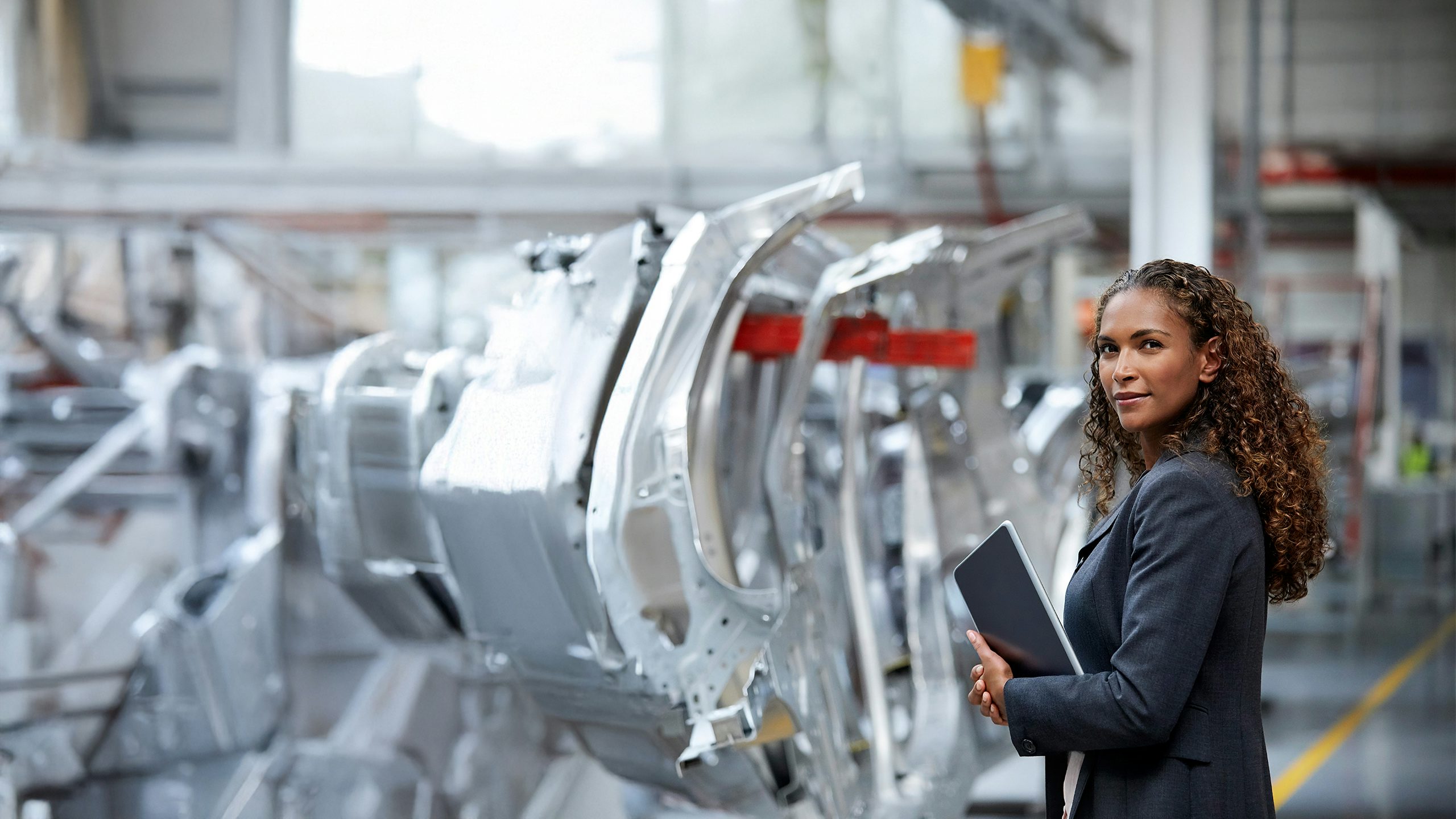 A Siemens automotive industry advertisement featuring a car in motion with a blurred background.