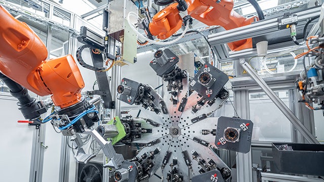 Industrial machinery with large cylindrical tanks and pipes in a factory setting