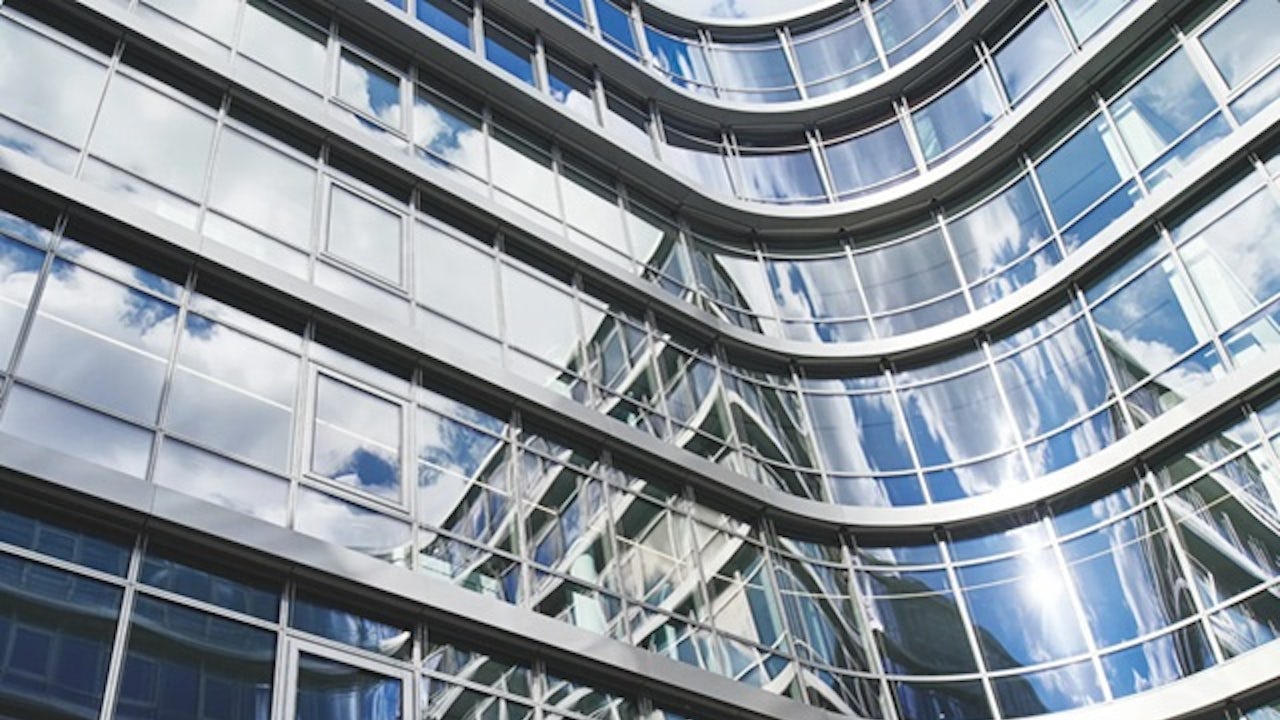 A Siemens building with a modern architectural design and a large glass window on the front facade.