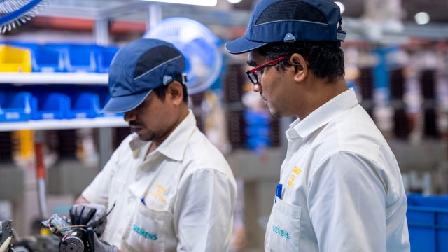 Aerial view of industrial complex with buildings and solar panels on rooftops