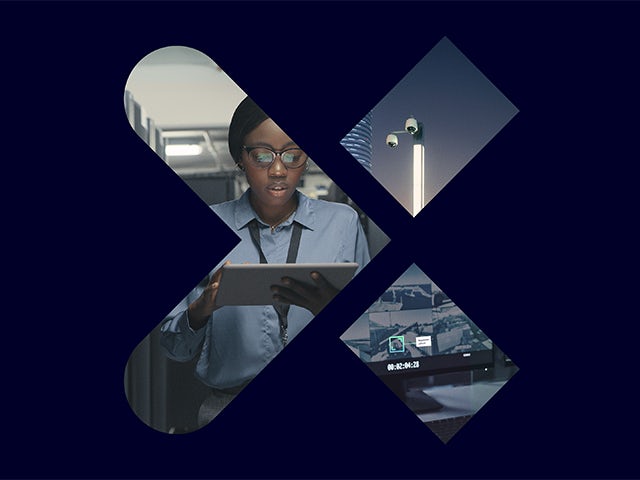 Security camera mounted on wall with blue sky and clouds in background