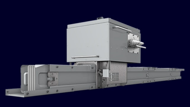 Industrial electrical switchgear with blue panels and silver components in a large room