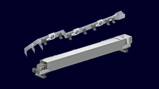 A busbar system with a silver-colored metal frame and a black background.