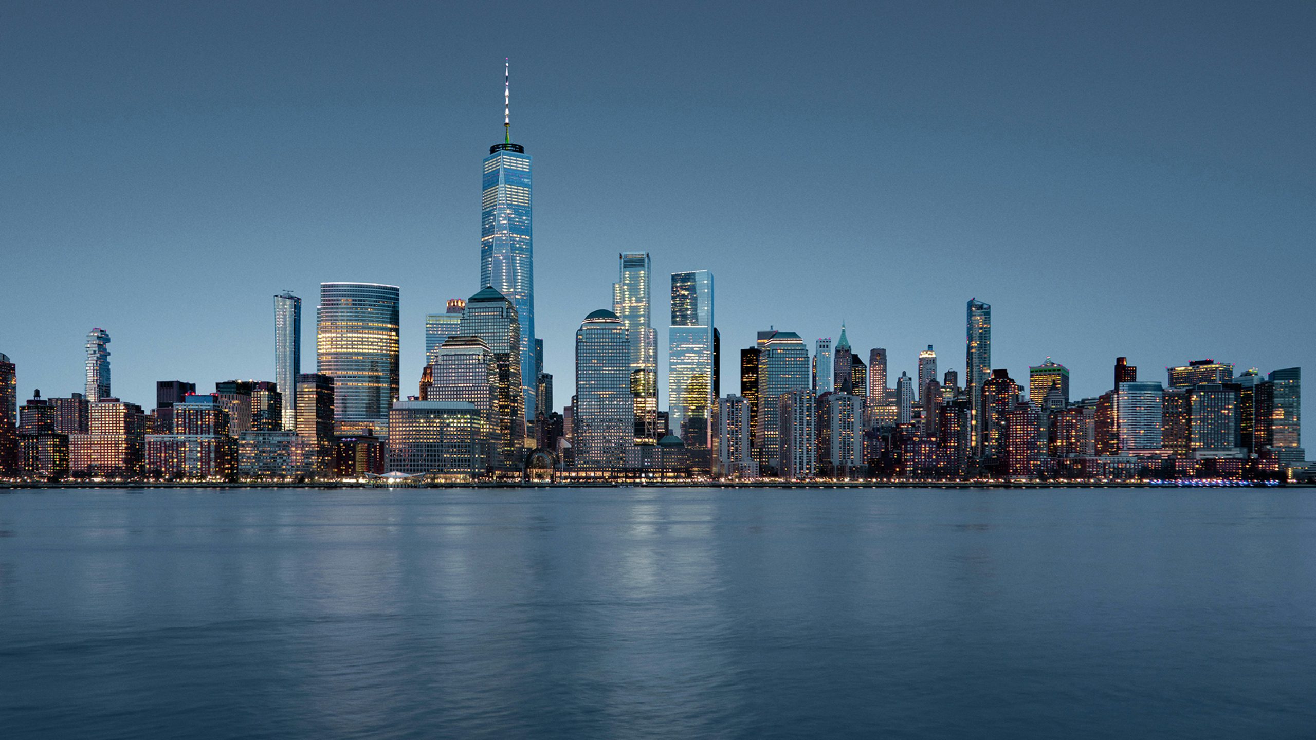 A smart infrastructure key visual with a modern cityscape and a futuristic building.