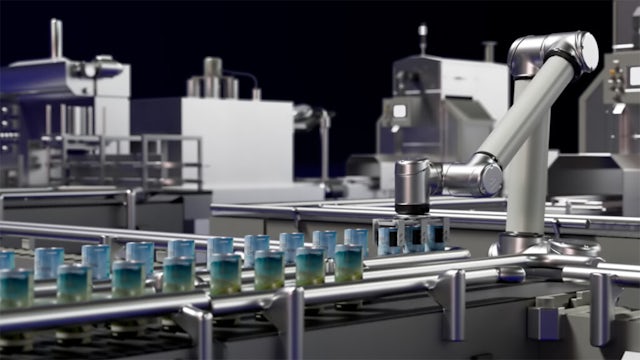 A factory with a large machine in the center, surrounded by workers and equipment.