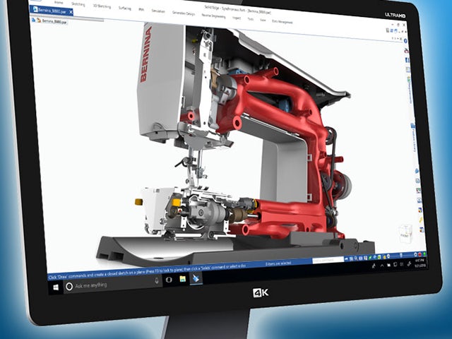 Black computer monitor displaying a red and light grey 3D model in Solid Edge.