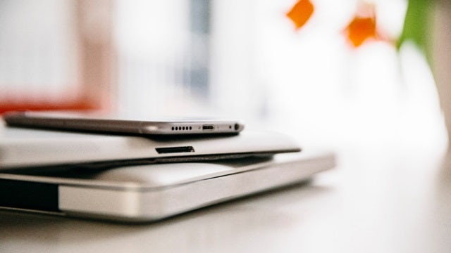 Stack of mobile devices with ports.