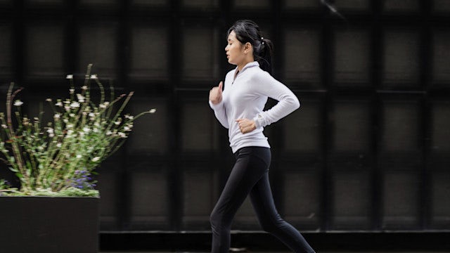 Woman jogging on pavement. 