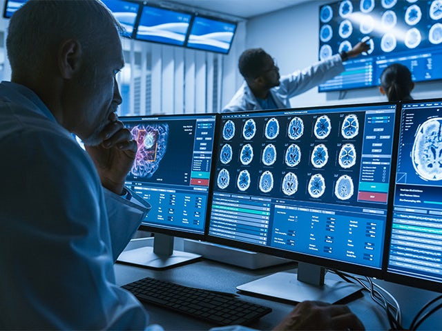 A promotional image for a medical device solution marketplace featuring a team of professionals in a meeting.