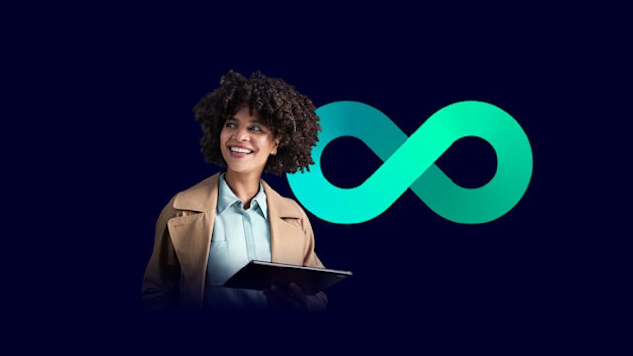 A woman standing with a laptop in front of a logo representing the digital enterprise.