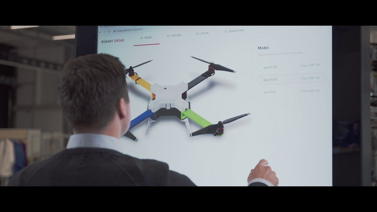 A man works on a project involving a drone.