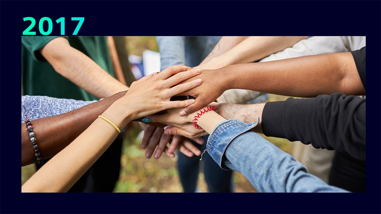 A framework for volunteering with a person in the center and arrows pointing outwards.