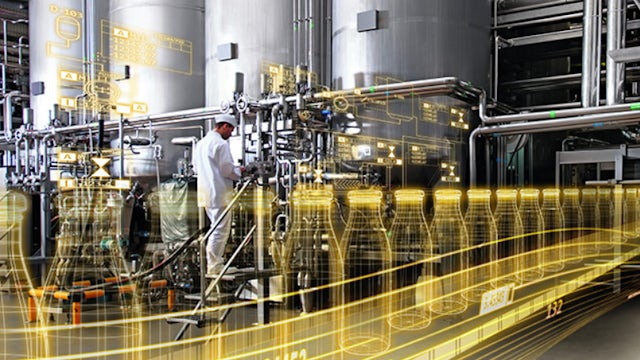 A person walking on a digital twin model for the Consumer Products Goods Industry.