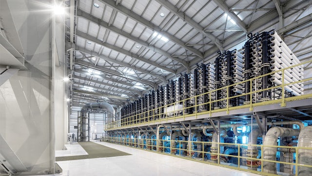 Interior of a desalination plant showing rows of pipes.
