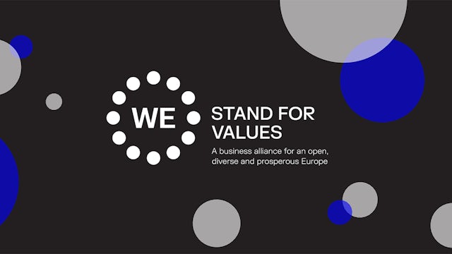 A group of people standing together with a banner that reads "We Stand for Values."